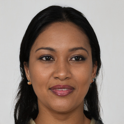 Joyful asian young-adult female with long  black hair and brown eyes