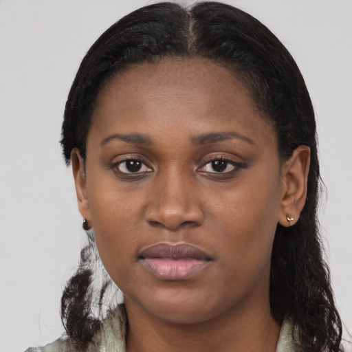 Joyful black young-adult female with medium  black hair and brown eyes