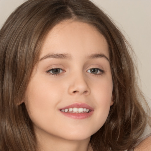 Joyful white child female with medium  brown hair and brown eyes