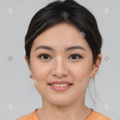 Joyful asian young-adult female with medium  brown hair and brown eyes