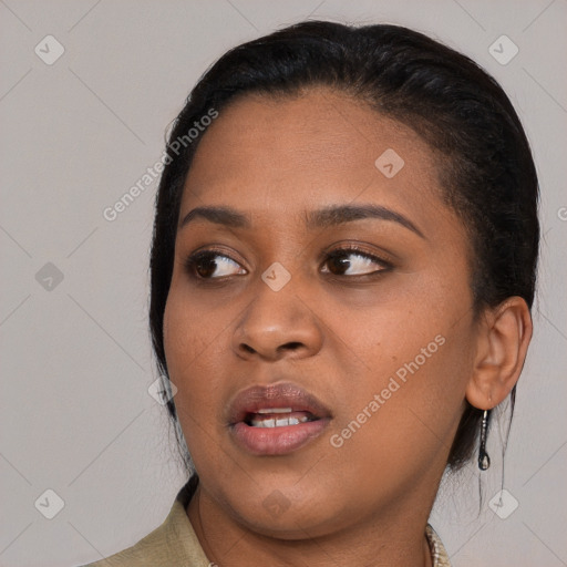 Joyful black young-adult female with medium  black hair and brown eyes