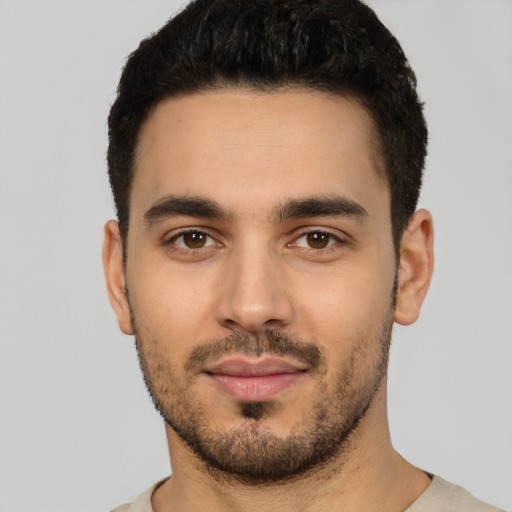 Neutral white young-adult male with short  black hair and brown eyes