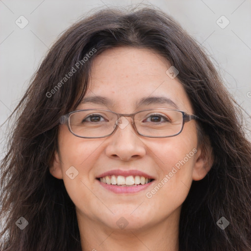 Joyful white adult female with long  brown hair and brown eyes