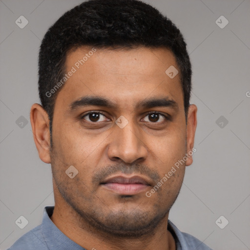 Joyful latino young-adult male with short  brown hair and brown eyes