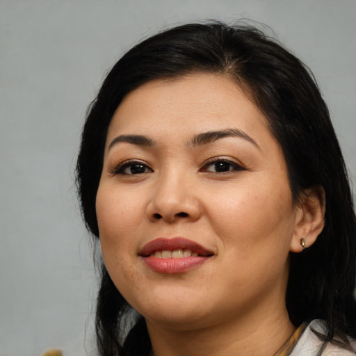 Joyful asian young-adult female with medium  black hair and brown eyes