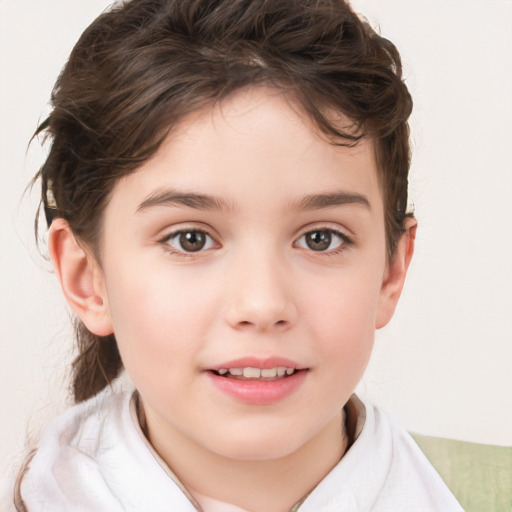 Joyful white child female with short  brown hair and brown eyes