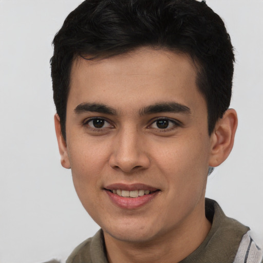 Joyful asian young-adult male with short  brown hair and brown eyes