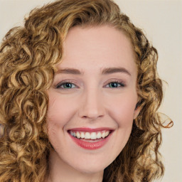 Joyful white young-adult female with long  brown hair and green eyes