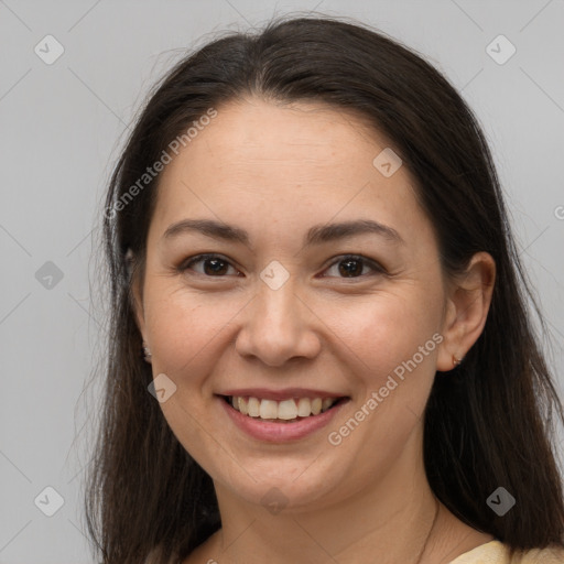 Joyful white young-adult female with long  brown hair and brown eyes