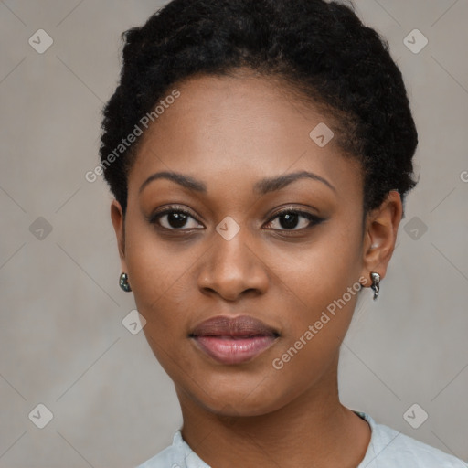 Joyful black young-adult female with short  black hair and brown eyes