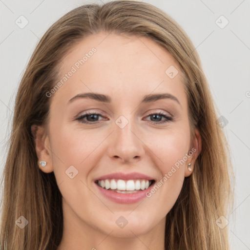 Joyful white young-adult female with long  brown hair and grey eyes