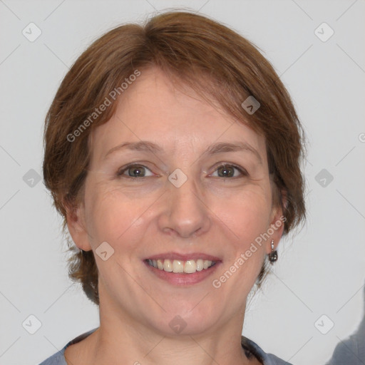 Joyful white adult female with medium  brown hair and grey eyes