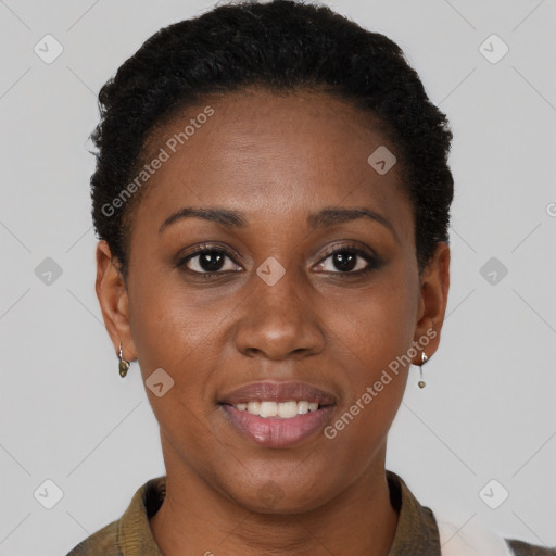 Joyful black young-adult female with short  brown hair and brown eyes