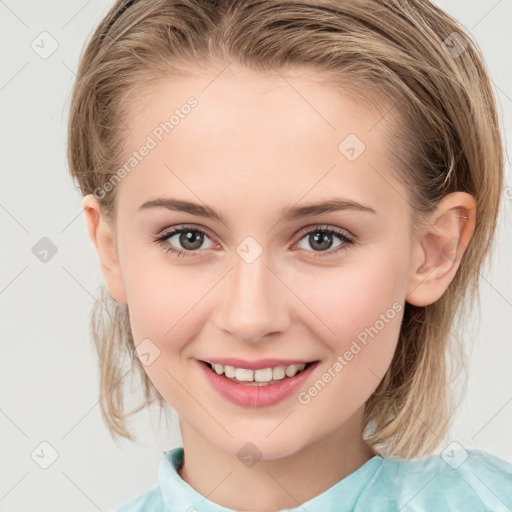 Joyful white child female with medium  brown hair and grey eyes