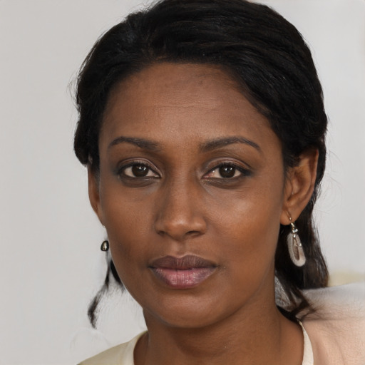 Neutral black adult female with medium  black hair and brown eyes