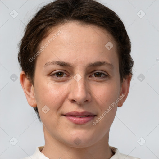 Joyful white young-adult female with short  brown hair and grey eyes