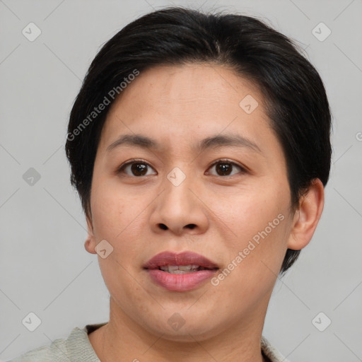 Joyful asian young-adult female with short  brown hair and brown eyes