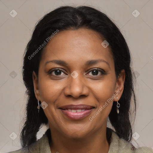 Joyful black adult female with medium  brown hair and brown eyes