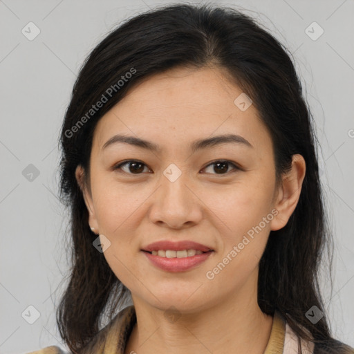 Joyful latino young-adult female with medium  brown hair and brown eyes