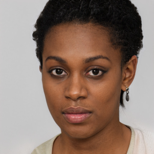 Neutral black young-adult female with short  brown hair and brown eyes