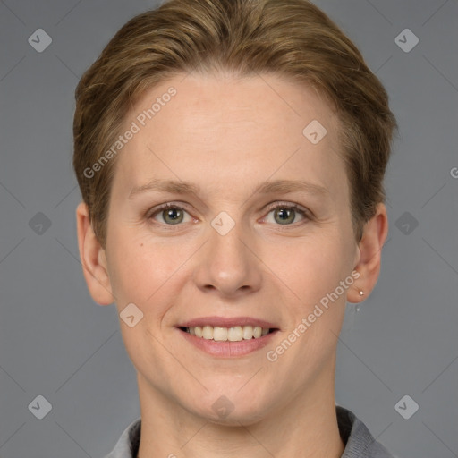 Joyful white adult female with short  brown hair and grey eyes