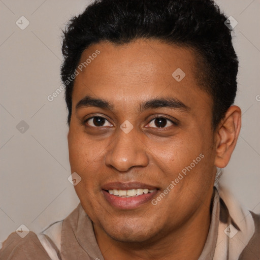 Joyful latino young-adult male with short  brown hair and brown eyes