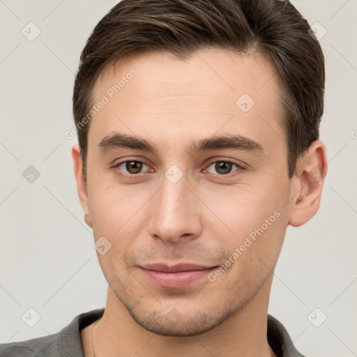 Joyful white young-adult male with short  brown hair and brown eyes