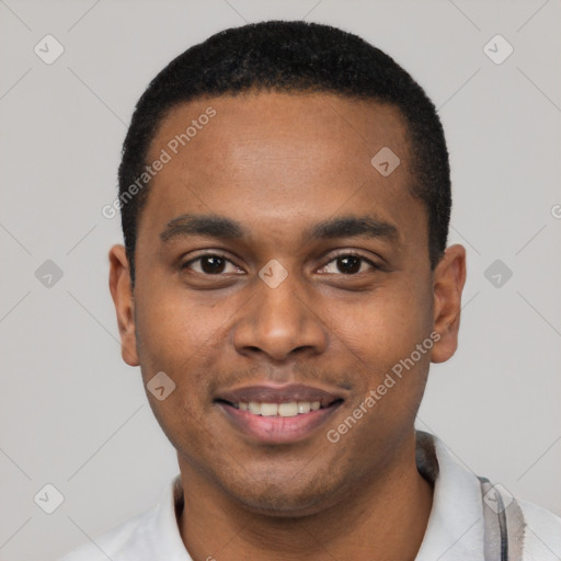 Joyful black young-adult male with short  black hair and brown eyes