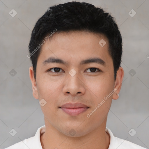 Joyful asian young-adult male with short  brown hair and brown eyes