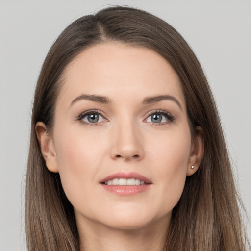 Joyful white young-adult female with long  brown hair and grey eyes