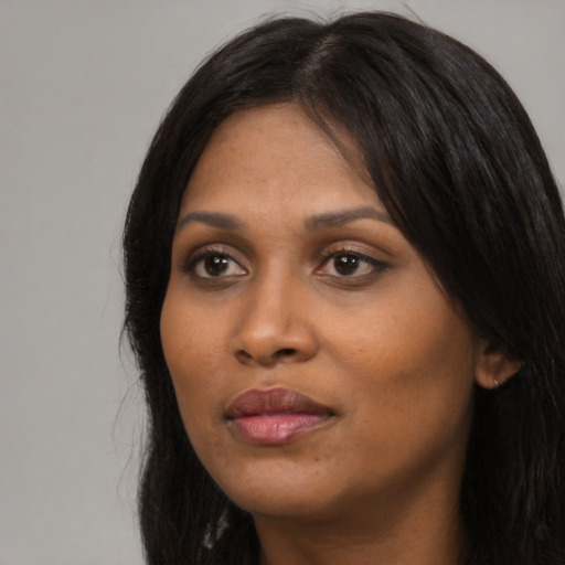 Neutral asian adult female with long  black hair and brown eyes