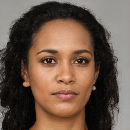 Neutral black young-adult female with long  brown hair and brown eyes