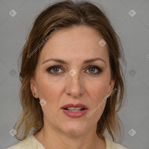 Joyful white adult female with medium  brown hair and grey eyes