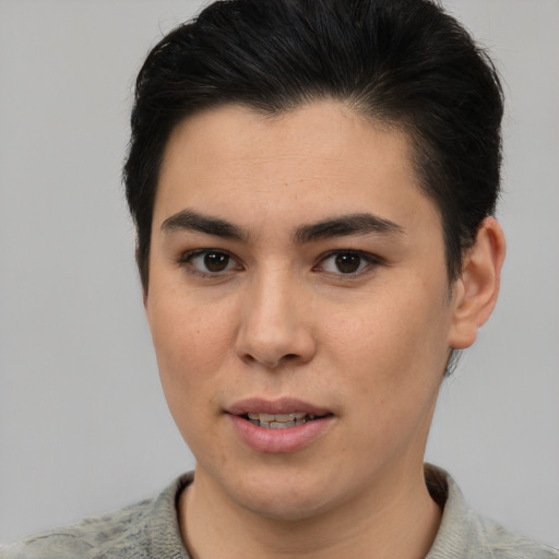 Joyful latino young-adult female with short  brown hair and brown eyes