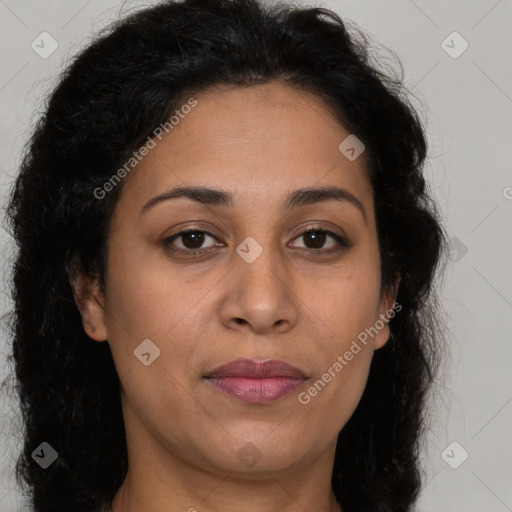 Joyful latino young-adult female with long  brown hair and brown eyes