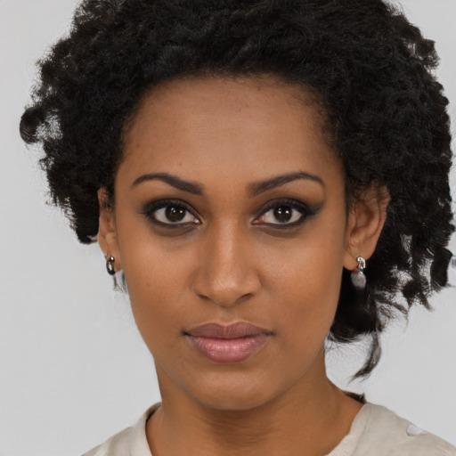 Neutral black young-adult female with medium  black hair and brown eyes