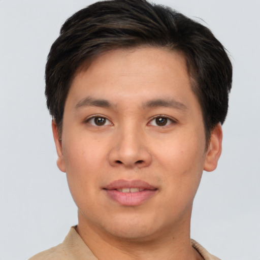 Joyful asian young-adult male with short  brown hair and brown eyes