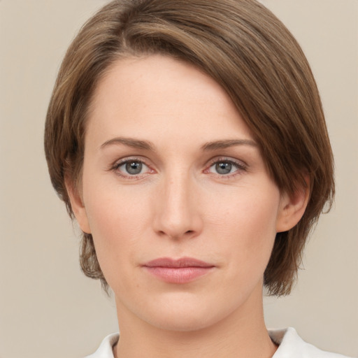 Neutral white young-adult female with medium  brown hair and green eyes