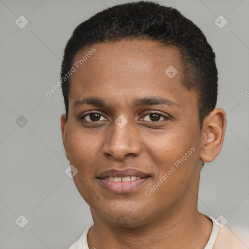 Joyful black young-adult male with short  brown hair and brown eyes