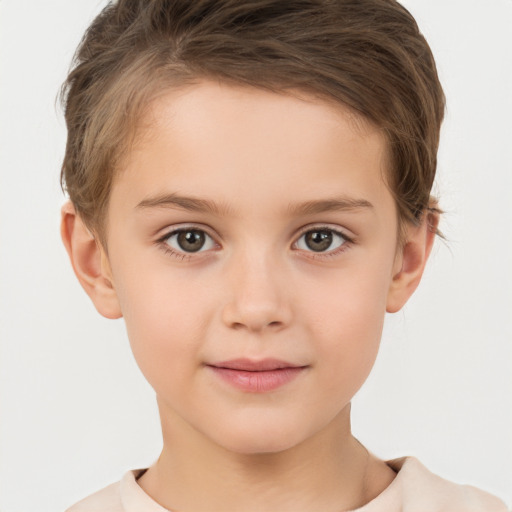 Joyful white child female with short  brown hair and brown eyes