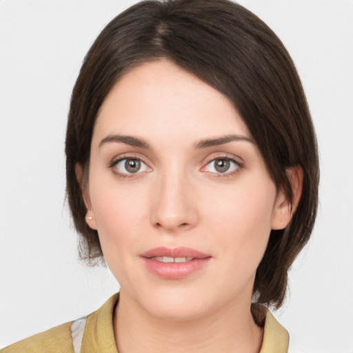 Neutral white young-adult female with medium  brown hair and brown eyes