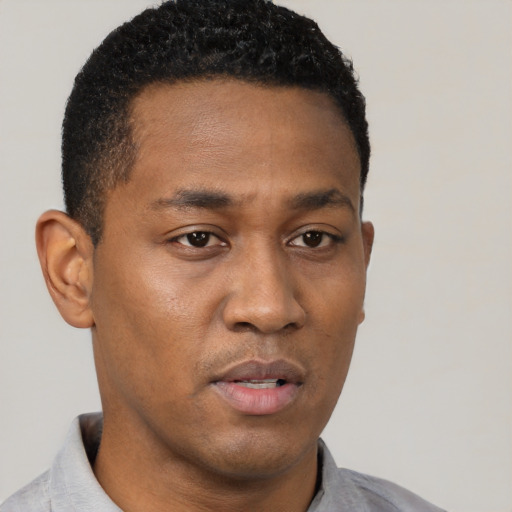 Neutral black young-adult male with short  black hair and brown eyes