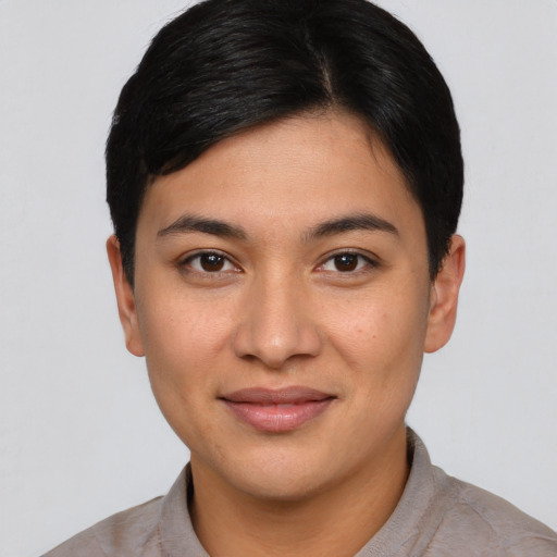 Joyful white young-adult female with short  black hair and brown eyes