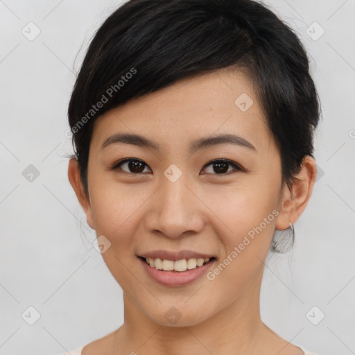 Joyful asian young-adult female with medium  brown hair and brown eyes