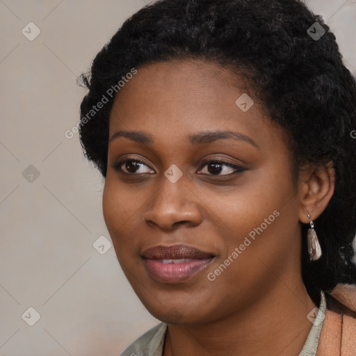 Joyful black young-adult female with medium  black hair and brown eyes