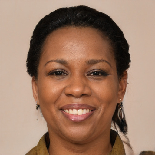 Joyful black adult female with short  black hair and brown eyes