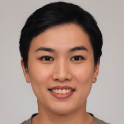 Joyful asian young-adult female with short  black hair and brown eyes