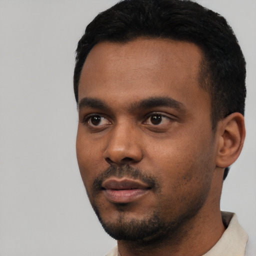 Neutral black young-adult male with short  black hair and brown eyes
