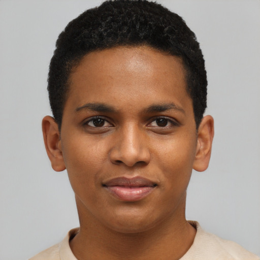 Joyful black young-adult male with short  black hair and brown eyes