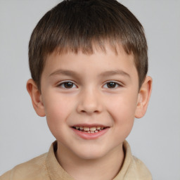 Joyful white child male with short  brown hair and brown eyes